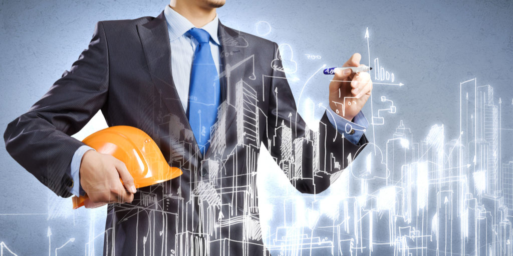 Construction engineer drawing sketches of construction project